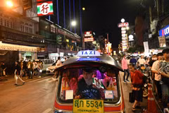 A tuk-tuk carrying tourists in the Chinatown area of Bangkok. (Photo: AFP) 