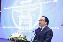 Vietnam, Laos share experience in local government activities