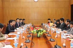 Vietnam, Laos share know-how in building economic development policies