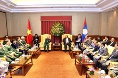 Lao Party-State leader meets former Vietnamese voluntary soldiers, experts