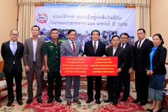 Vietnamese community in Laos donate for flood victims 