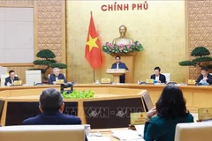 Prime Minister Pham Minh Chinh addresses the Government’s monthly regular meeting on December 7. (Photo: VNA)