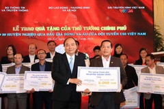 Proceeds from auction of U23 team’s ball, jersey presented to poor districts