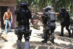 Malaysian police arrest eight terrorist suspects 