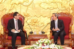 Party official receives Japanese professor, ambassador