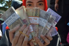 Malaysian Ringgit climbs 10 percent against USD
