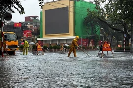 Heavy rain floods multiple streets in Hanoi