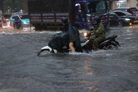 Heavy overnight rain leaves many streets in Hanoi deeply flooded