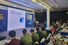 Colonel Le Hoang Duong from the Ministry of Public Security delivers the opening remarks at the event. (Photo: VNA)