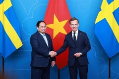 Vietnamese Prime Minister Pham Minh Chinh (L) and his Swedish counterpart Ulf Kristersson. (Photo: VNA)