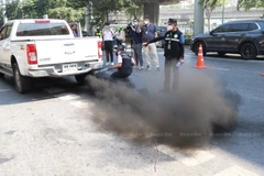 Officers measure emissions from a pickup truck at a checkpoint set up in front of Chatuchak Park on Phahon Yothin Road in Bangkok in January 2024. (Photo: Bangkokpost)