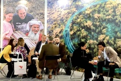 Foreign visitors at the ITB Berline 2025 show their interest in Vietnam's tourism products. (Photo: VNA)