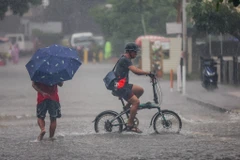Flooding in Quezon, Philippines, following heavy rains triggered by Typhoon Wipha (Photo: Xinhua/VNA)