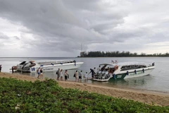 Tourists board a ferry in Phuket province. Slowing arrivals in the low season of 2025 could prompt hotels to cut prices. (Photo: BangkokPost)