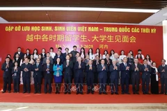 Party General Secretary To Lam and delegates attend the Vietnam - China alumni gathering in Hanoi on March 20. (Photo: VNA)