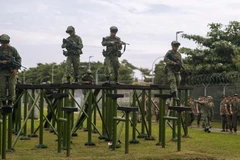 Singapore guardsmen complete an obstacle course during exercise Valiant Mark with U.S. Marine Rotational Force-Southeast Asia in Singapore in December 2024. (Photo: SGT. SHAINA JUPITER/U.S. MARINE CORPS)