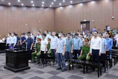 The defendants listen as the court delivers the verdict.(Photo: VNA)