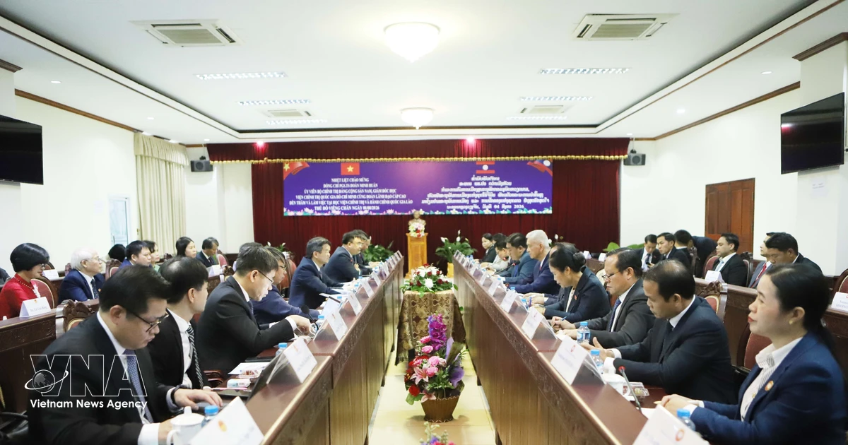 Vietnam, Laos step up cooperation in political theory, training