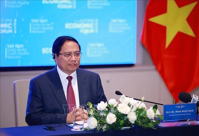 Prime Minister Pham Minh Chinh speaks at the working session with representatives from foreign enterprises in the financial sector (Photo: VNA)