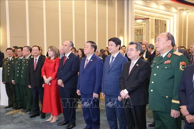 Officials join a reception in Ha Noi on December 2 evening to celebrate the 65th anniversary of Viet Nam-Cuba diplomatic relations. (Photo: VNA)