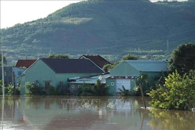 Houses inundated by storm-triggered flooding. (Photo: VNA)