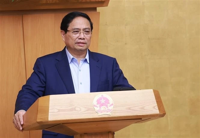 Prime Minister Pham Minh Chinh chairing the Government's meeting on October 5 (Photo: VNA)