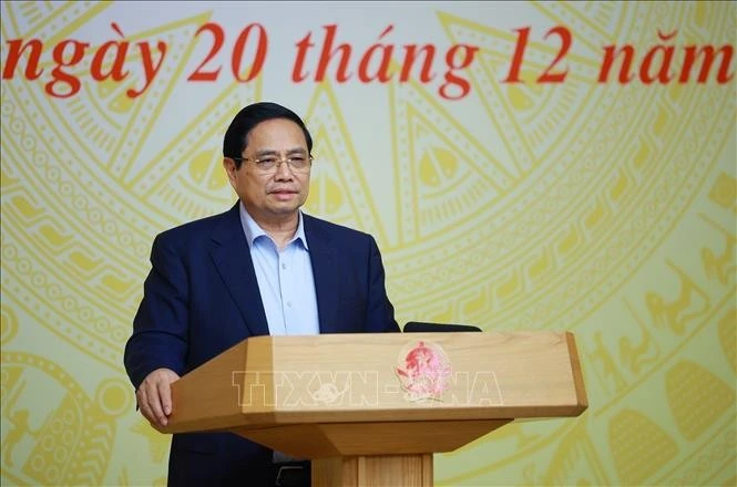 Prime Minister Pham Minh Chinh addresses he third meeting of the National Steering Committee implementing the Politburo’s Resolution 68 in Ha Noi on December 20. (Photo: VNA)