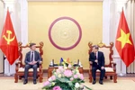 Chief Justice of the Supreme People's Court of Vietnam Le Minh Tri (right) receives EU Ambassador to Vietnam Julien Guerrier on April 18. (Photo: VNA)