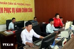 Officials of Thuong Trach commune's Public Administration Centre in Quang Tri province make concerted efforts to promote digital transformation and build an e-administration system. (Photo: VNA)
