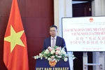 Vietnamese Ambassador to China Pham Thanh Binh speaks at the exchange programme. (Photo: VNA)