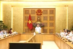 Permanent Deputy Minister Nguyen Hoa Binh presides over a meeting on September 9 o assess the enforcement of laws on decentralisation, delegation of authority, and delineation of responsibilities. (Photo: VNA)