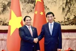 Prime Minister Pham Minh Chinh (L) meets with Wang Huning, member of the Standing Committee of the Political Bureau of the Communist Party of China Central Committee and Chairman of the Chinese People's Political Consultative Conference National Committee on September 1. (Photo: VNA)