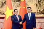 Prime Minister Pham Minh Chinh (L) meets with Wang Huning, member of the Standing Committee of the Political Bureau of the Communist Party of China Central Committee and Chairman of the Chinese People's Political Consultative Conference National Committee on September 1. (Photo: VNA)