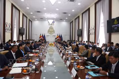 Delegates at the meeting between Vietnamese businesses operating in Cambodia and the Council for the Development of Cambodia (CDC) on September 14. (Photo: VNA)