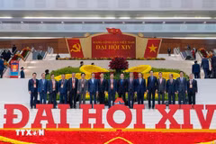 Ambassador Trinh Duc Hai (third from right) and other delegates attending the 14th National Party Congress (Photo: VNA)