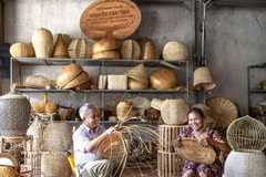 Artisan Nguyen Van Tinh (left) in Chuong My’s traditional bamboo and rattan weaving village remains deeply passionate about his craft (Photo: VNA) 