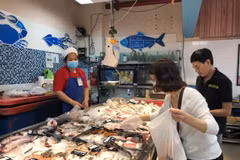 A woman goes to the supermarket in HCM City. (Photo: VNA)