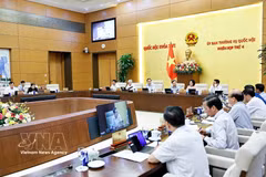 Deputies attend the fourth session of the National Assembly Standing Committee in Hanoi on July 15. (Photo: VNA)