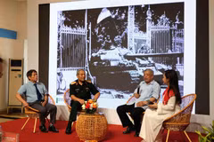 Historical witnesses, journalists, photographers and representatives of the younger generation take part in a panel discussion held as part of the exhibition. (Photo: VietnamPlus)