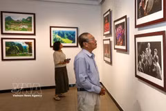 Visitors view the exhibition (Photo: VNA)