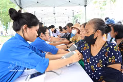 At present, 132 of Ho Chi Minh City's 168 communes, wards and special zones have recorded a check-up rate of at least 30% of the population. (Photo: VNA)