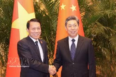 Minister of Public Security Gen. Luong Tam Quang (L) and Secretary of the CPC's Central Political and Legal Affairs Commission Chen Wenqing (Photo: VNA)