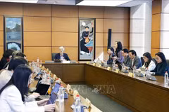 An overview of a group discussion on the draft Law on Artificial Intelligence (Photo: VNA)