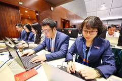 Vietnam News Agency reporters covering the 14th National Party Congress (Photo: VNA)