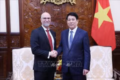 State President Luong Cuong (R) and Canadian Ambassador Shawn Perry Steil at the meeting on June 26 (Photo: VNA)