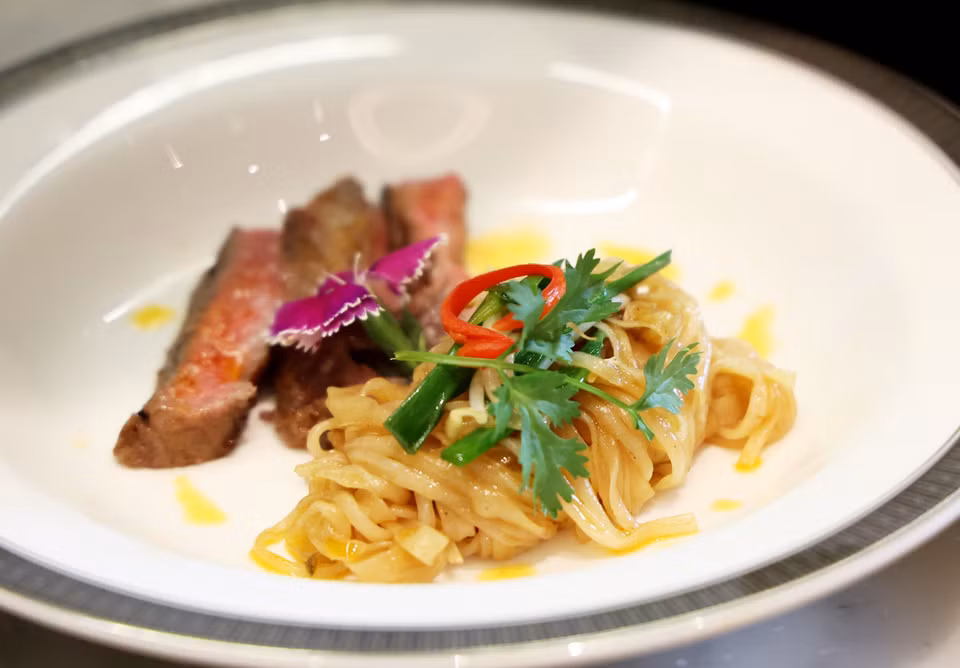 The stir-fried pho features a secret sauce and perfectly chewy noodles, paired with premium Satsuma Wagyu sirloin. (Photo: VNA)