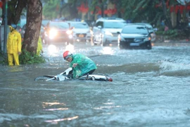 Heavy downpours submerge many streets in Hanoi