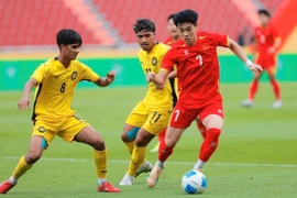 SEA Games 33: Vietnam reach semifinals with 2–0 victory over Malaysia
