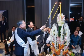 Top Vietnamese leaders attend traditional Lao wrist-tying ceremony