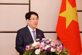 State President Luong Cuong speaks at the meeting with the Vietnamese community in Laos on April 25. (Photo: VNA)